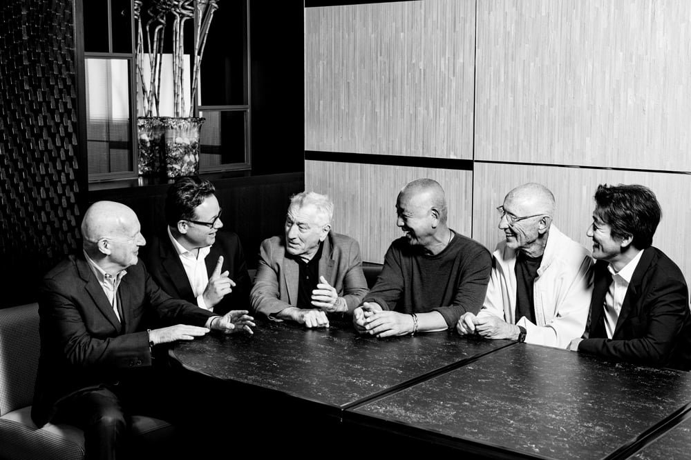 black and white photo of men at a table